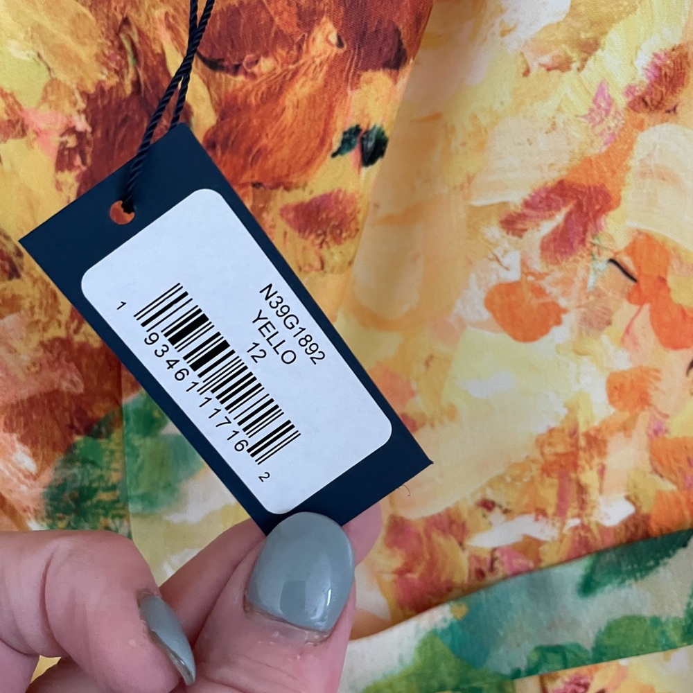 Beautiful New designer dress size 12 .Never worn.Has original tags still on it